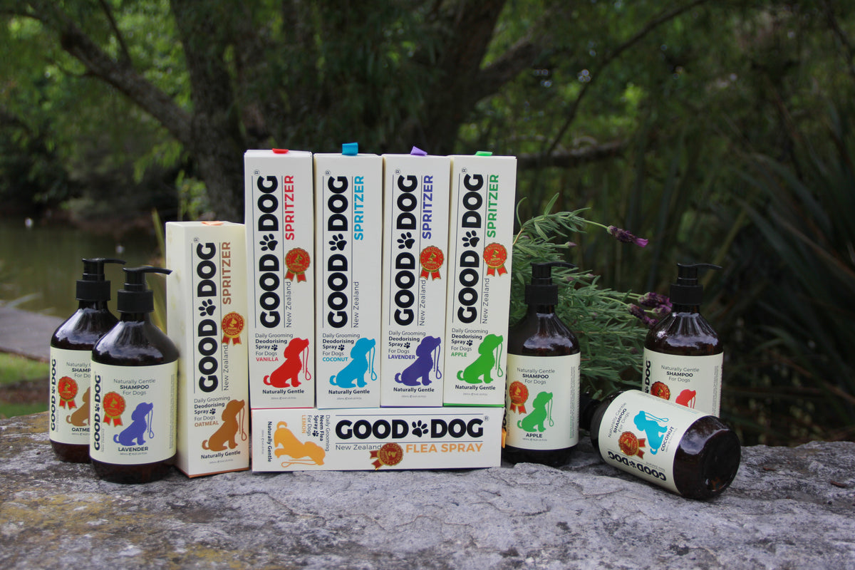 Good Dog shampoo and spritzer range displayed on a stone in the garden